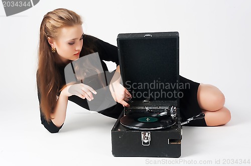 Image of Pretty woman with gramophone