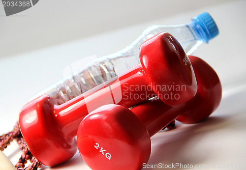 Image of Red dumbbells 