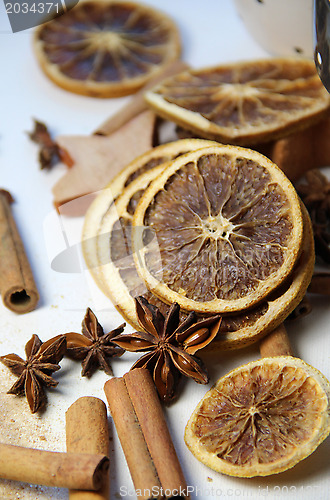 Image of Cinnamon sticks and dry orange