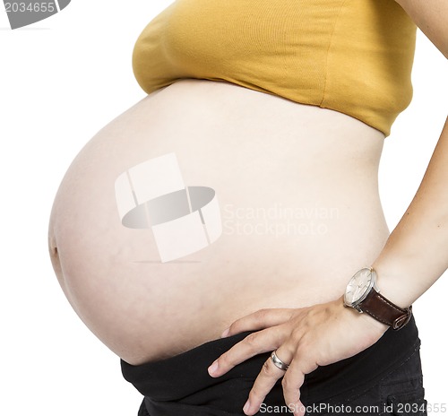 Image of Pregnant belly isolated