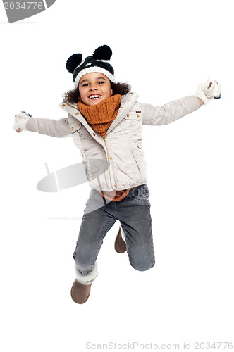 Image of Excited primary girl jumping with joy