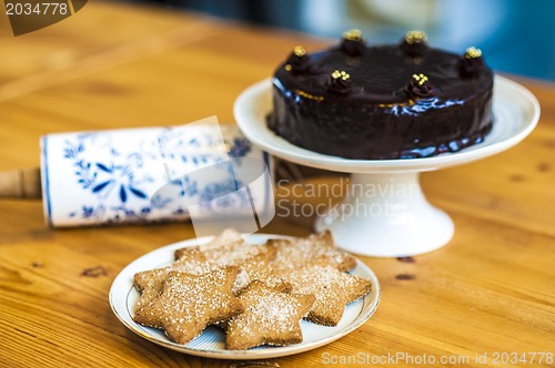 Image of Rich chocolate cake and star shaped cookies