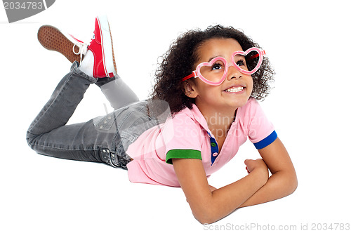 Image of Young girl wearing funny heart shaped frame