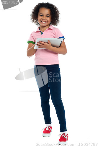 Image of Primary child with a tablet pc smiling cheerfully