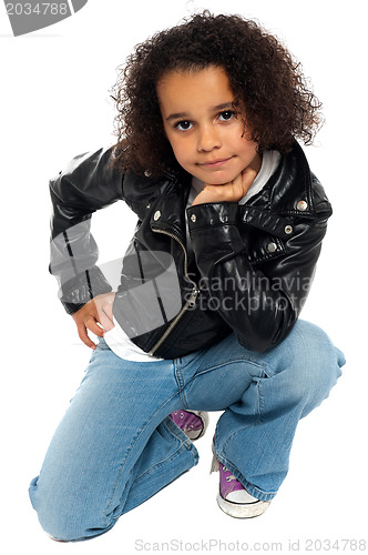 Image of Afro American kid posing stylishly to the camera