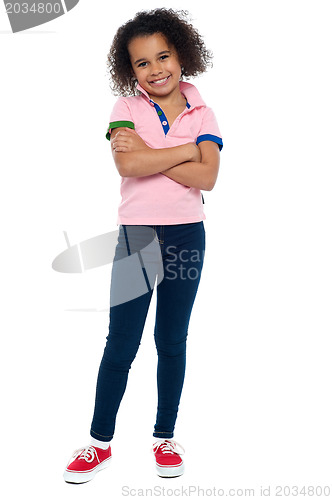 Image of Fashionable trendy girl striking a stylish pose