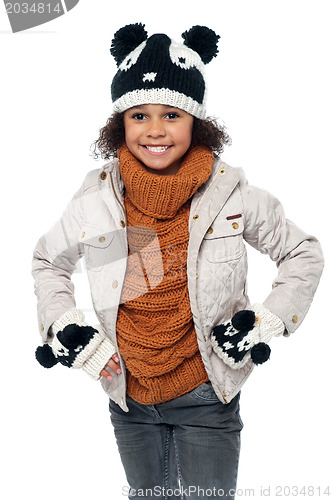 Image of Cute little girl in fashionable warm winter clothes