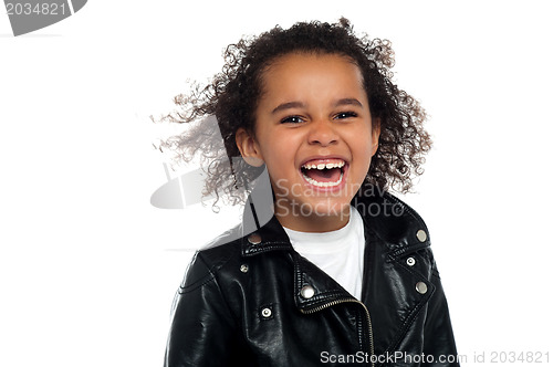 Image of Profile shot of an elementary kid laughing heartily