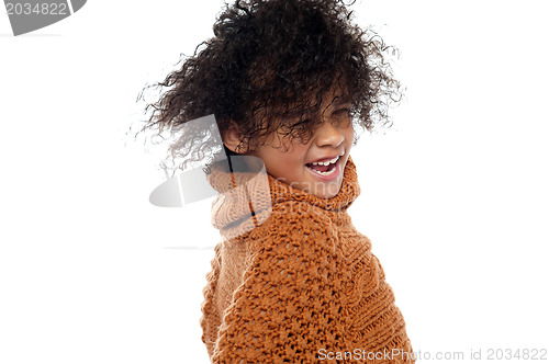 Image of Shot of curly haired girl having a great time