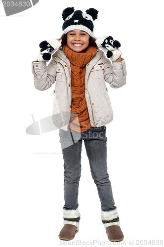 Image of Charming young girl enjoying winters