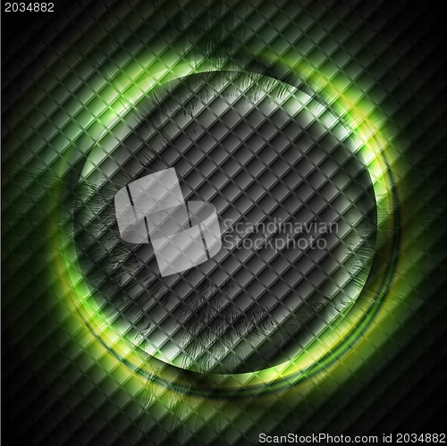 Image of Green ring on dark square texture
