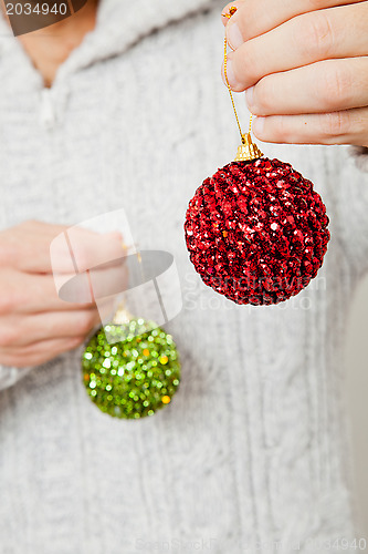 Image of Red and green Christmas baubles