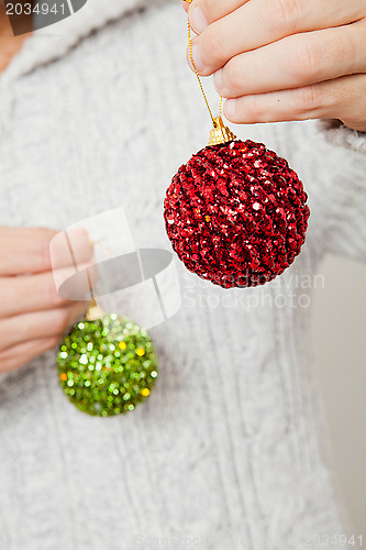 Image of Red and green Christmas baubles