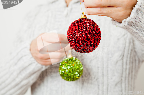 Image of Red and green Christmas baubles