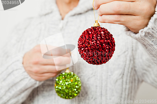 Image of Red and green Christmas baubles