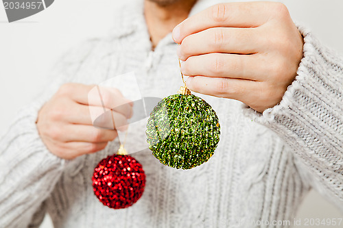 Image of Red and green Christmas baubles