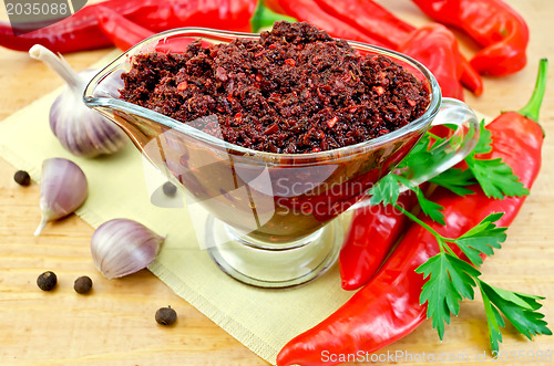 Image of Ajika in a glass gravy boat on board