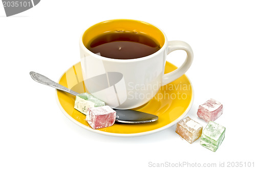 Image of Tea in yellow cup with lokum