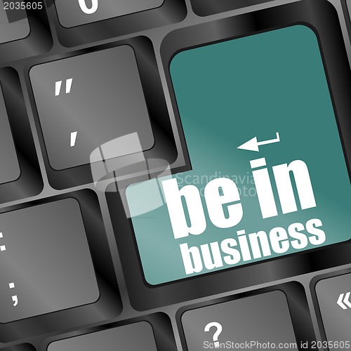 Image of key with be in business text on laptop keyboard