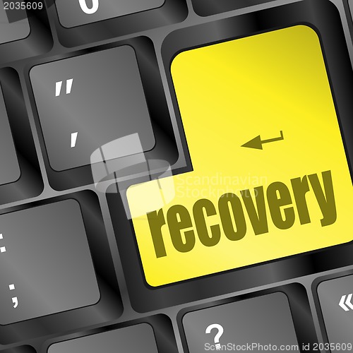 Image of key with recovery text on laptop keyboard