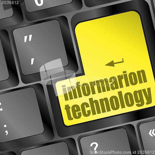 Image of key with information technology text on laptop keyboard