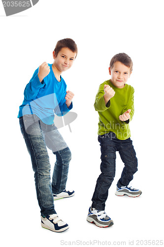 Image of Two boys in a fighting stance.