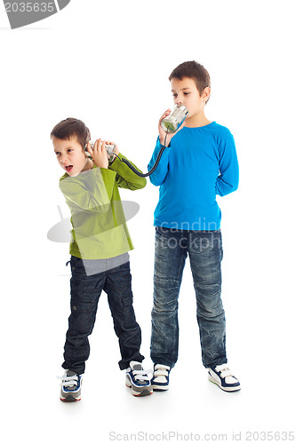 Image of  Two boys calling tin can phone.