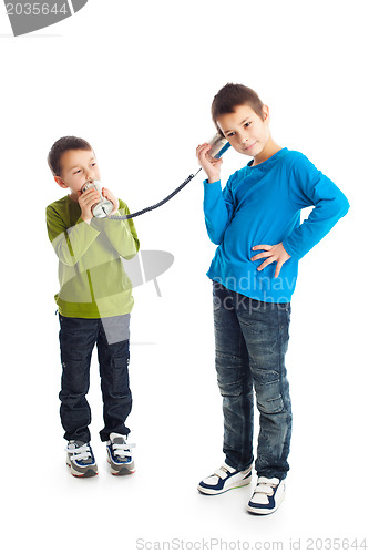 Image of  Two boys calling tin can phone.