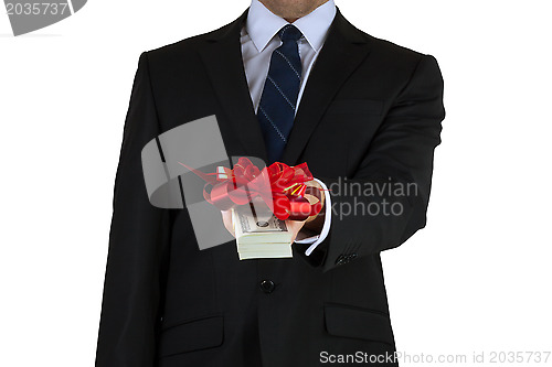 Image of businessman holding cash with ribbon