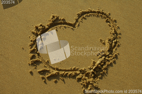 Image of love heart on sand