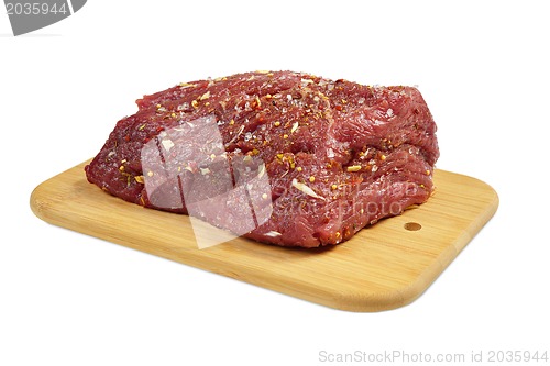 Image of Beef with spices on board