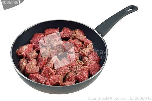 Image of Raw meat in pan.