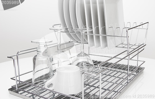 Image of Metal dish rack with dishes and glasses