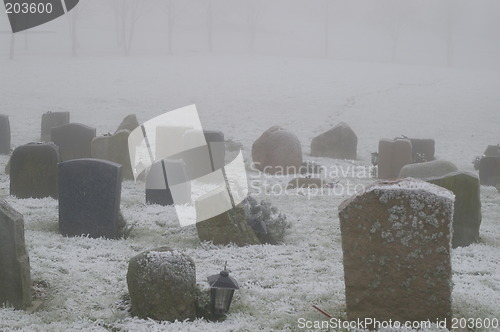 Image of Snow covered tombstones
