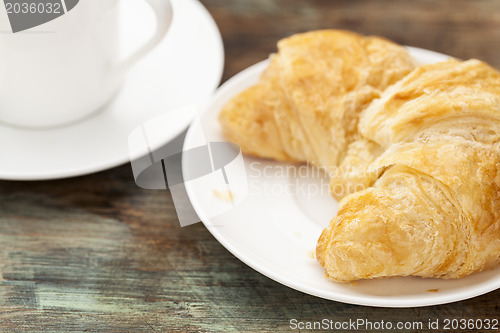 Image of croissant roll and coffee