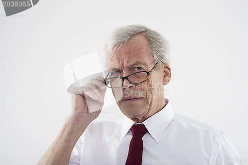 Image of Handsome retired man in glasses