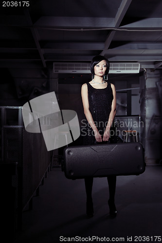 Image of Woman with suitcase