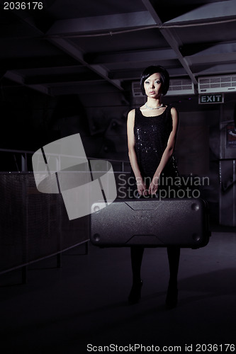 Image of Woman with suitcase