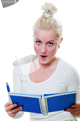 Image of The young woman looks a note in a notebook