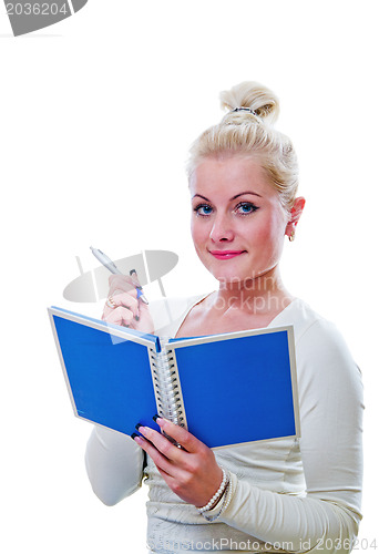 Image of The young woman looks a note in a notebook
