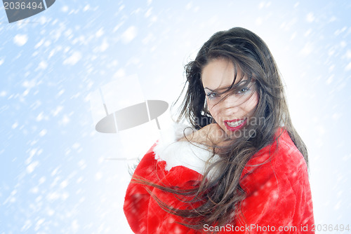 Image of Happy female Santa in snowstorm