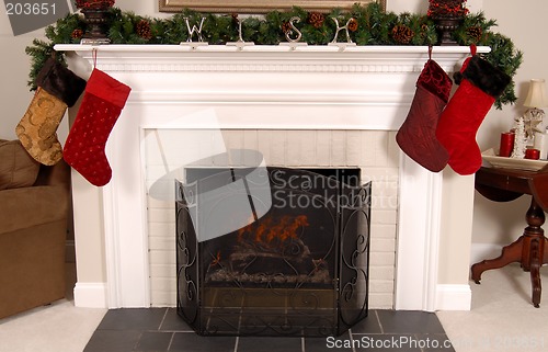 Image of White fireplace decorated for Christmas