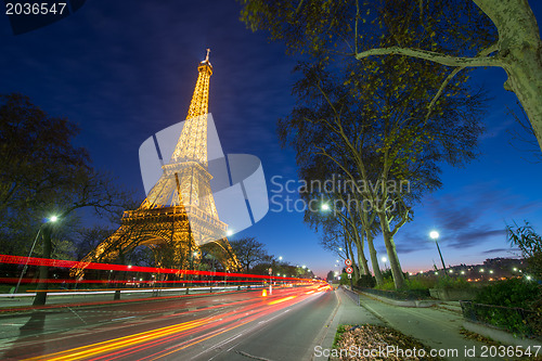 Image of Wonderful colors of Eiffel Tower. Winter sunset with car light t