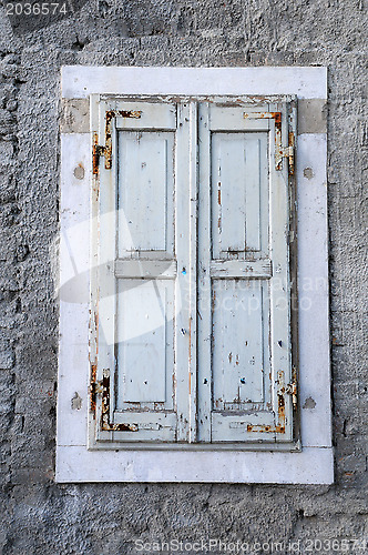 Image of Window with Unpainted Shutters