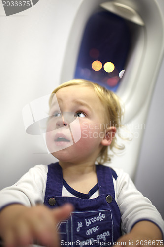 Image of Young passenger in the plane.