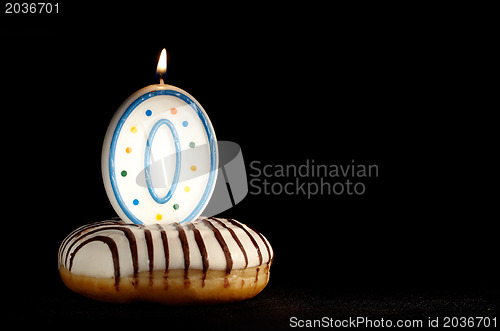 Image of Candle o in the doughnut. New beginnings.