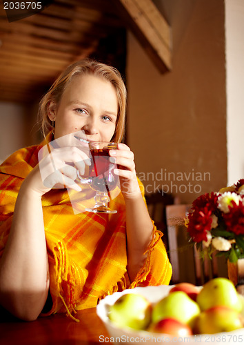 Image of Young woman is drinking tea.