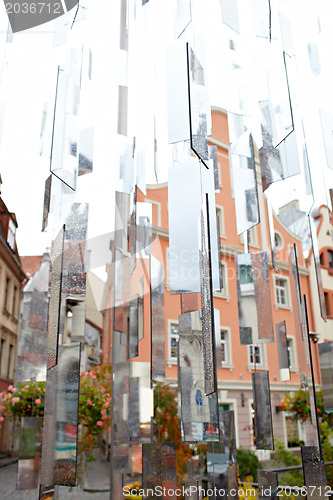 Image of City reflects in mirrors.