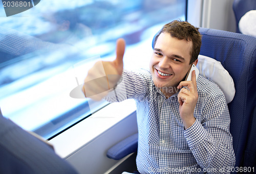 Image of Young successful businessman in the train.