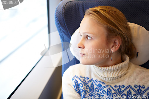 Image of Young woman in the train.